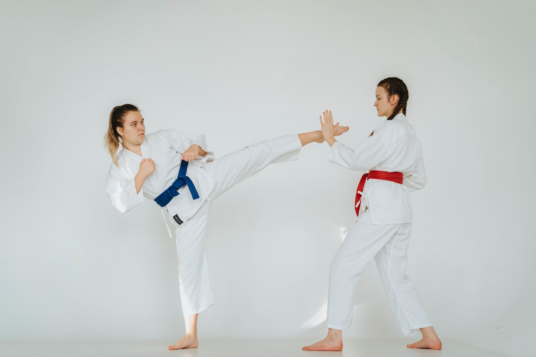 girls in uniforms practicing karate
